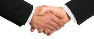 Macargo-manos-acuerdo-negociación